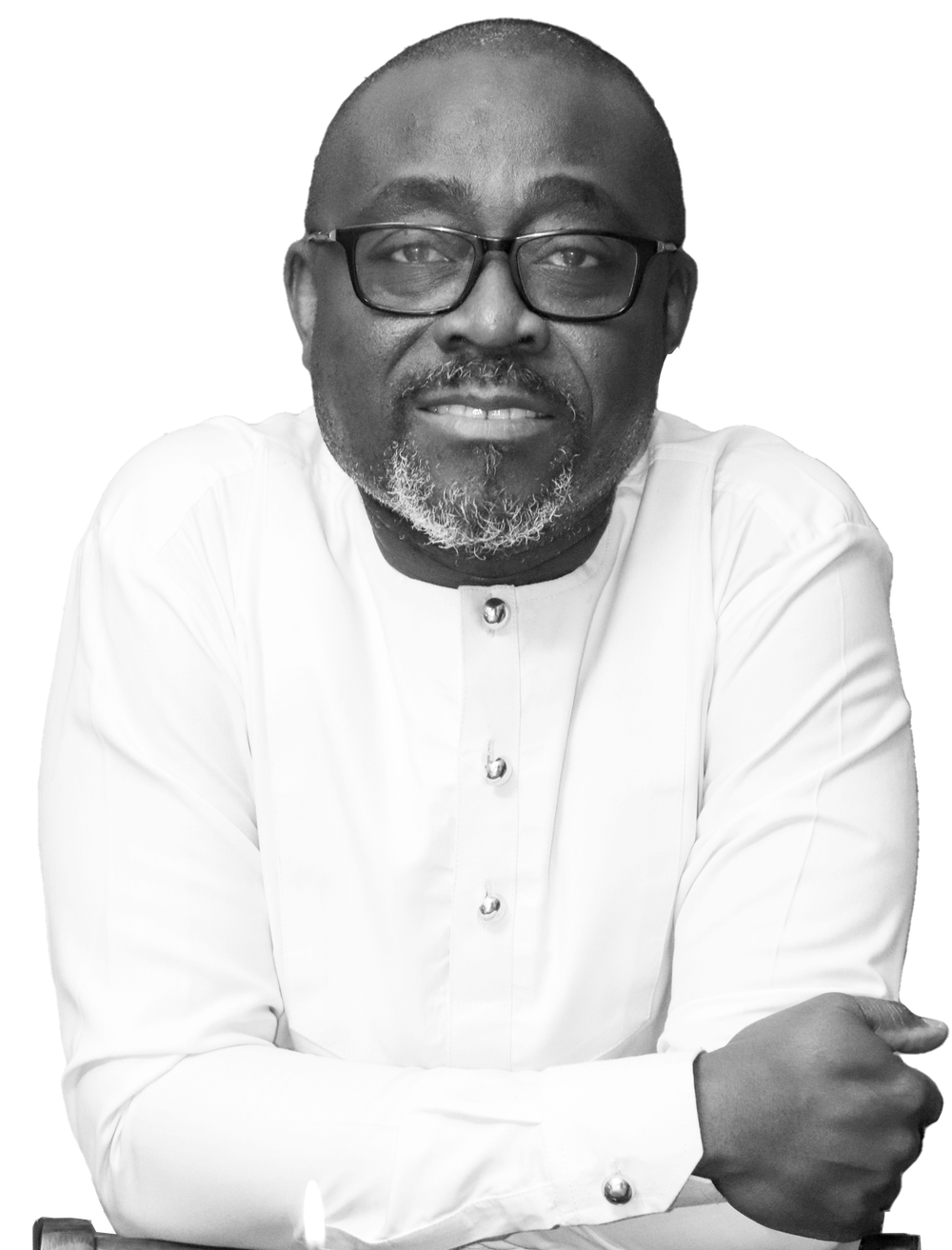 Black-and-white portrait of Jasper Dafeamekpor in a white shirt, arms folded